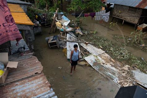 the floods have made the village inaccessible|Devastating Floods Submerge the Philippines .
